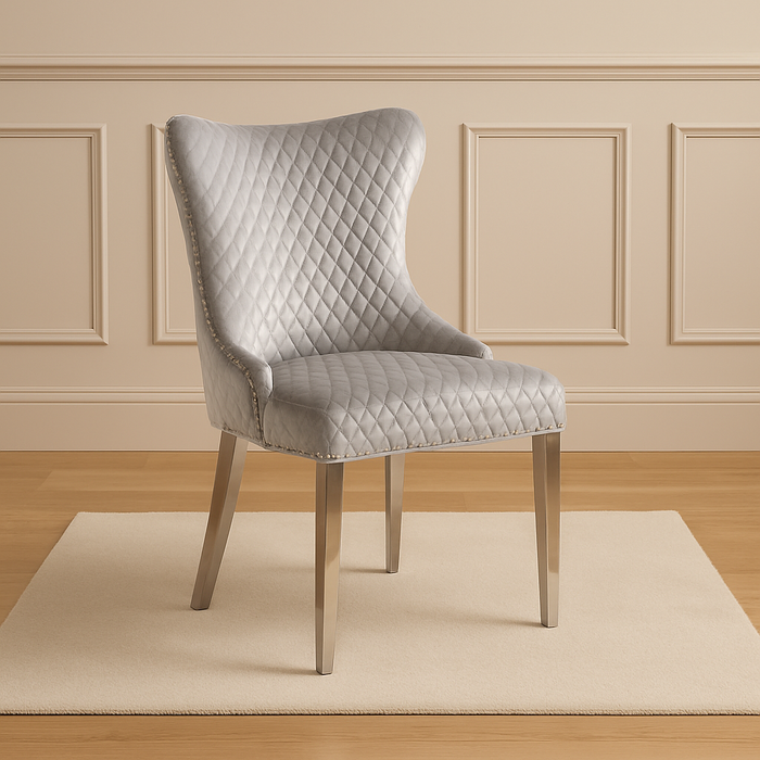 Pair of Lewis Pewter silver buttoned back dining chairs with lions head