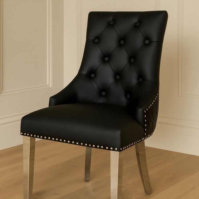 Pair of Bentley black leather knocker dining chairs lions head