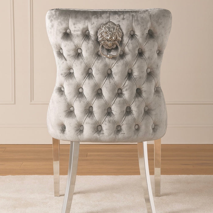 Pair of Lewis Pewter silver buttoned back dining chairs with lions head