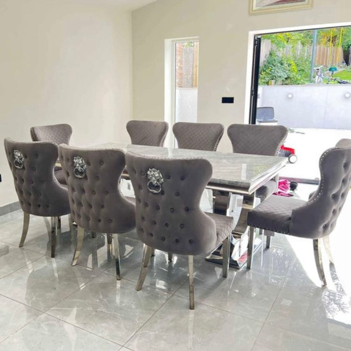 Ariana Marble 2 metre dining table with 8 velvet Lewis dining chairs with button back lion knockers