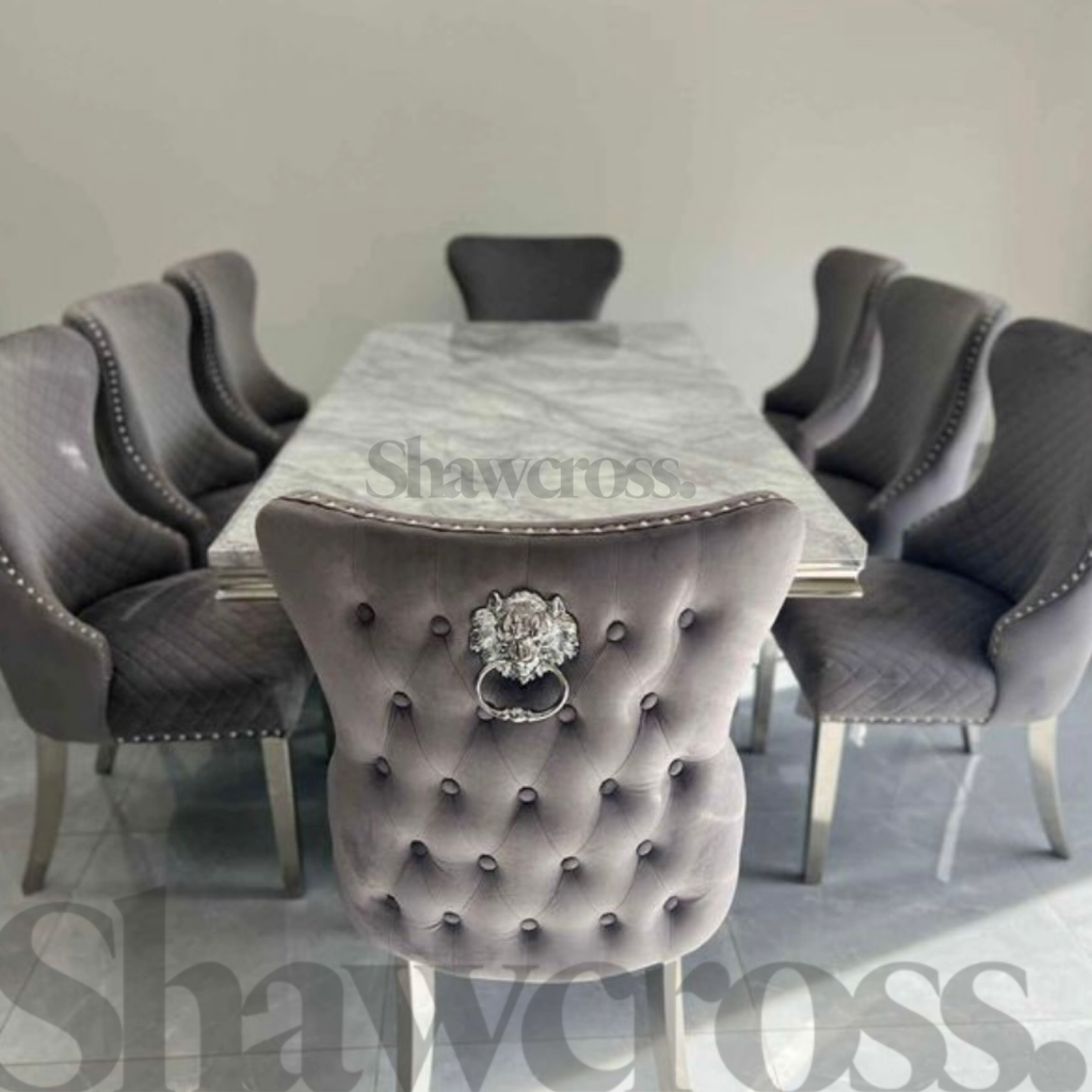 Ariana Marble 2 metre dining table with 8 velvet Lewis dining chairs with button back lion knockers
